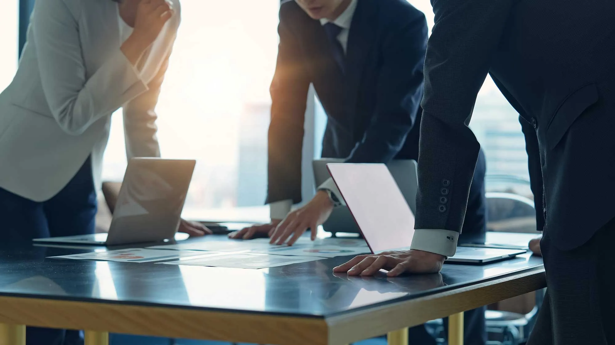 A group of professionals gathered around a conference table