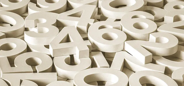 A scattered pile of large white 3D numbers overlapping one another.